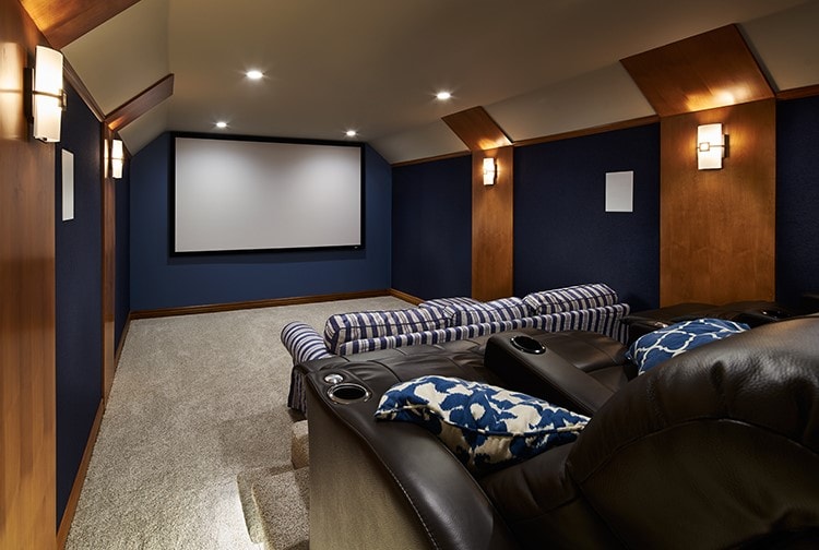 Home theater with navy walls, wood accents and leather recliners — La Crescenta