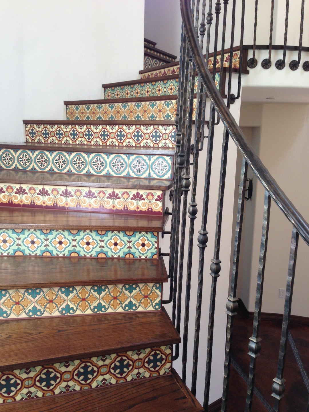 Ornate Moroccan-style tiled stair risers with wrought iron railing — Studio City